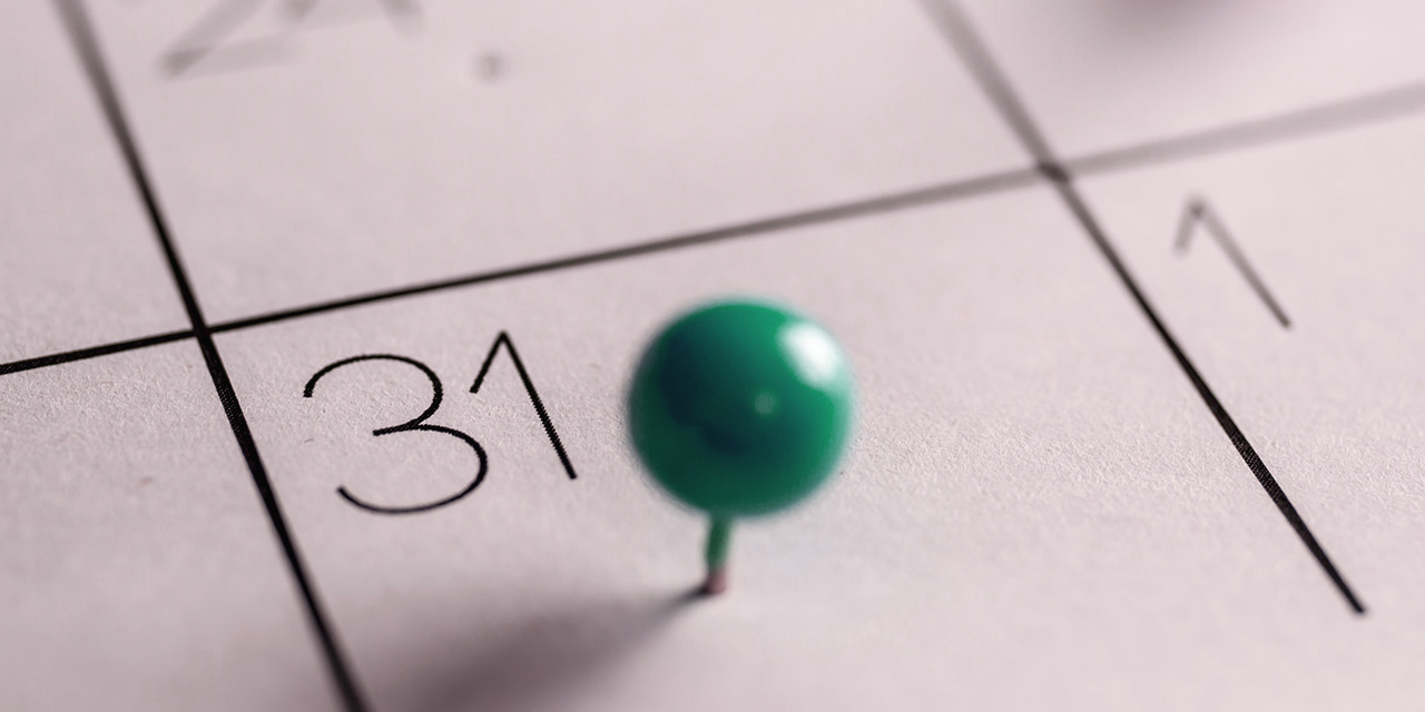 green push pin on the 31st day of a monthly calendar  green push pin on the 31st day of a monthly calendar