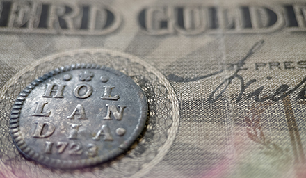 Photo: Old Dutch coins from the province of Holland with ancient Dutch banknotes. Photo: Old Dutch coins from the province of Holland with ancient Dutch banknotes.