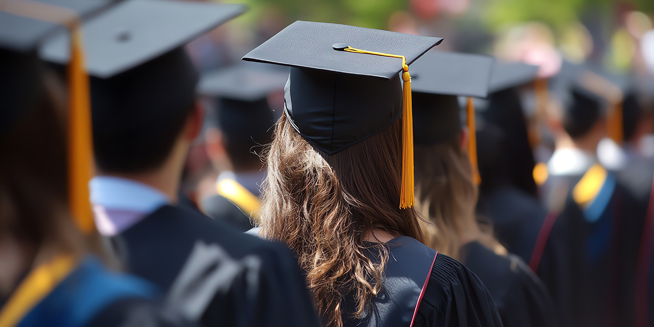 Image of back of college students in cap and gowns Image of back of college students in cap and gowns